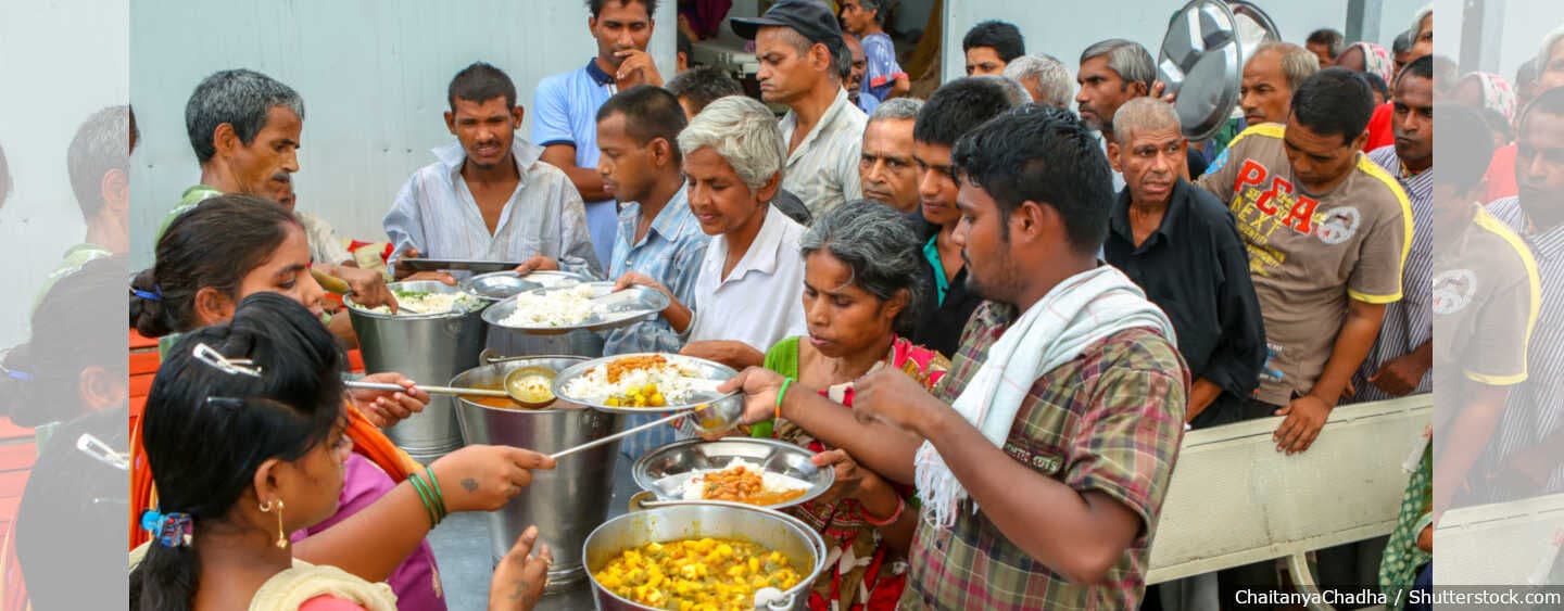 Volunteers serving free food at Jonojivan Garib Kalyan Bhandara